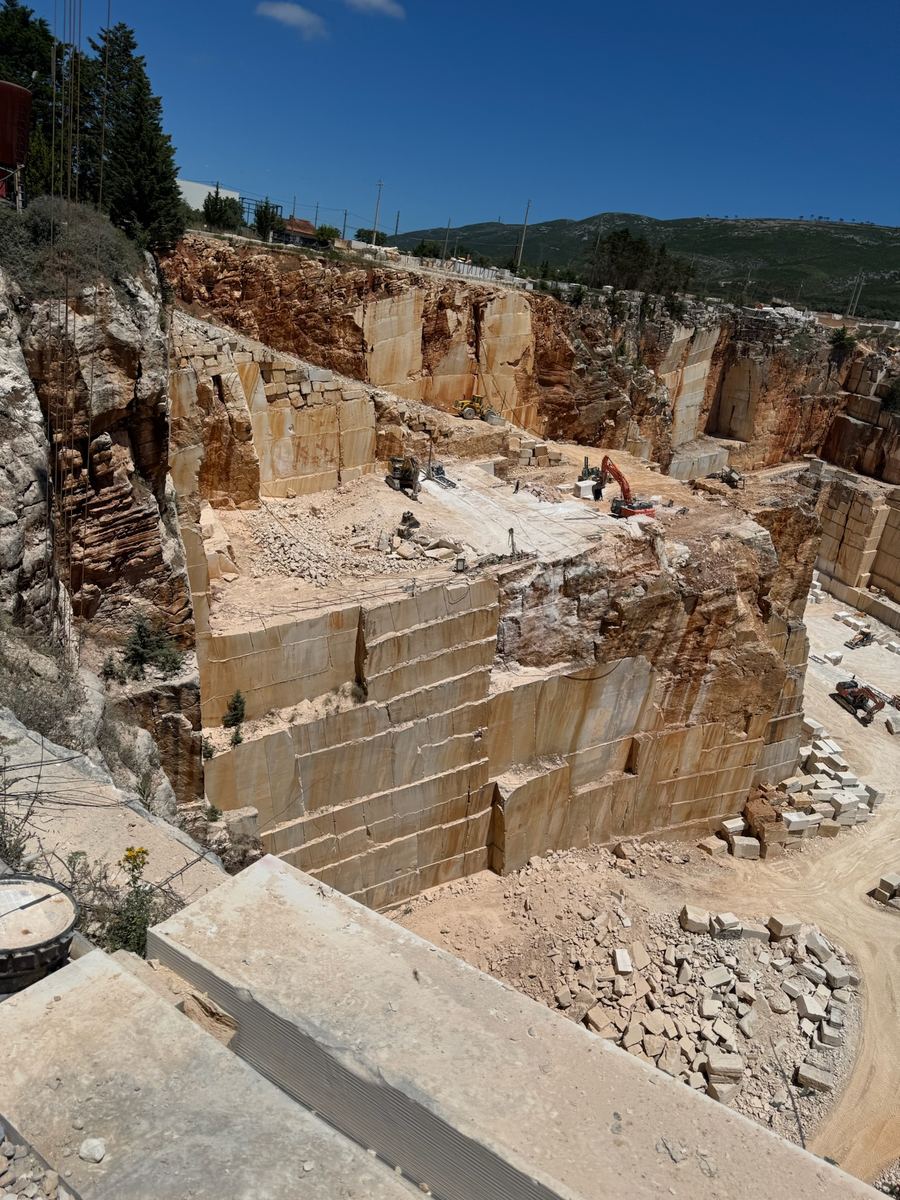 Terraced benches of a working marble quarry