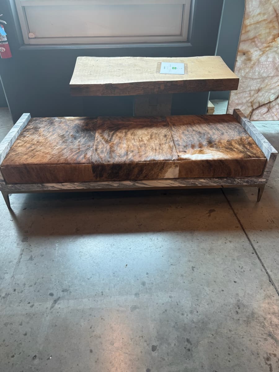 Live-edge stone tables on their stands
