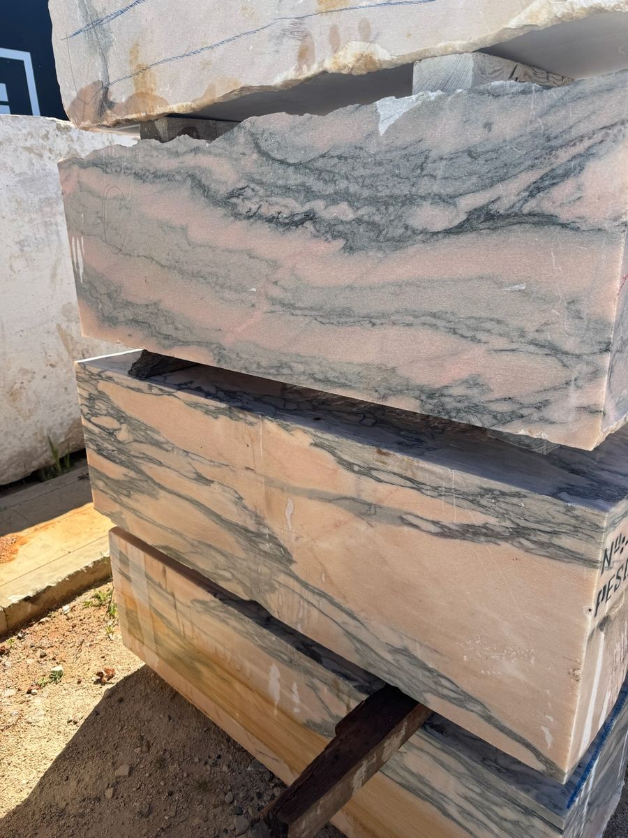 Pink and grey veined marble slabs on timber bearers