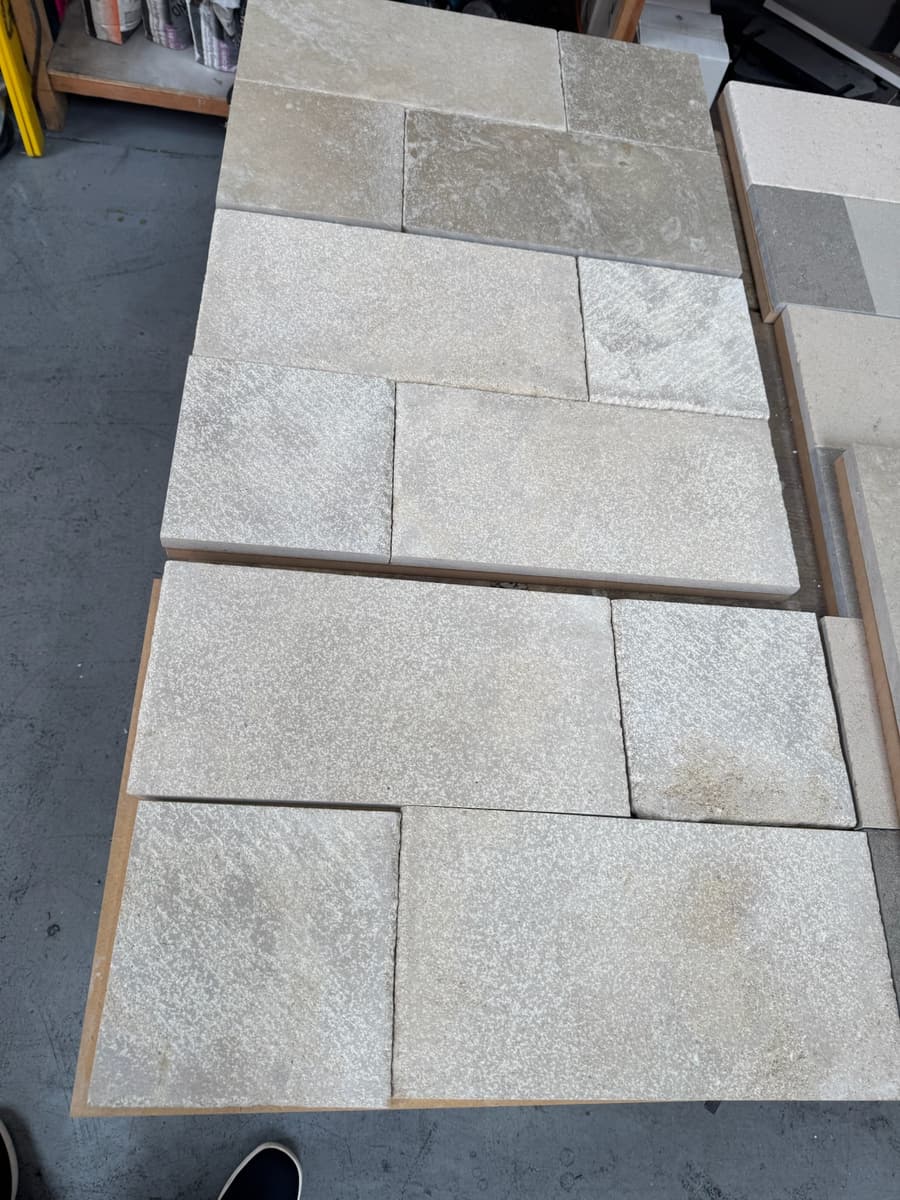 Tumbled limestone tile laid in a pattern