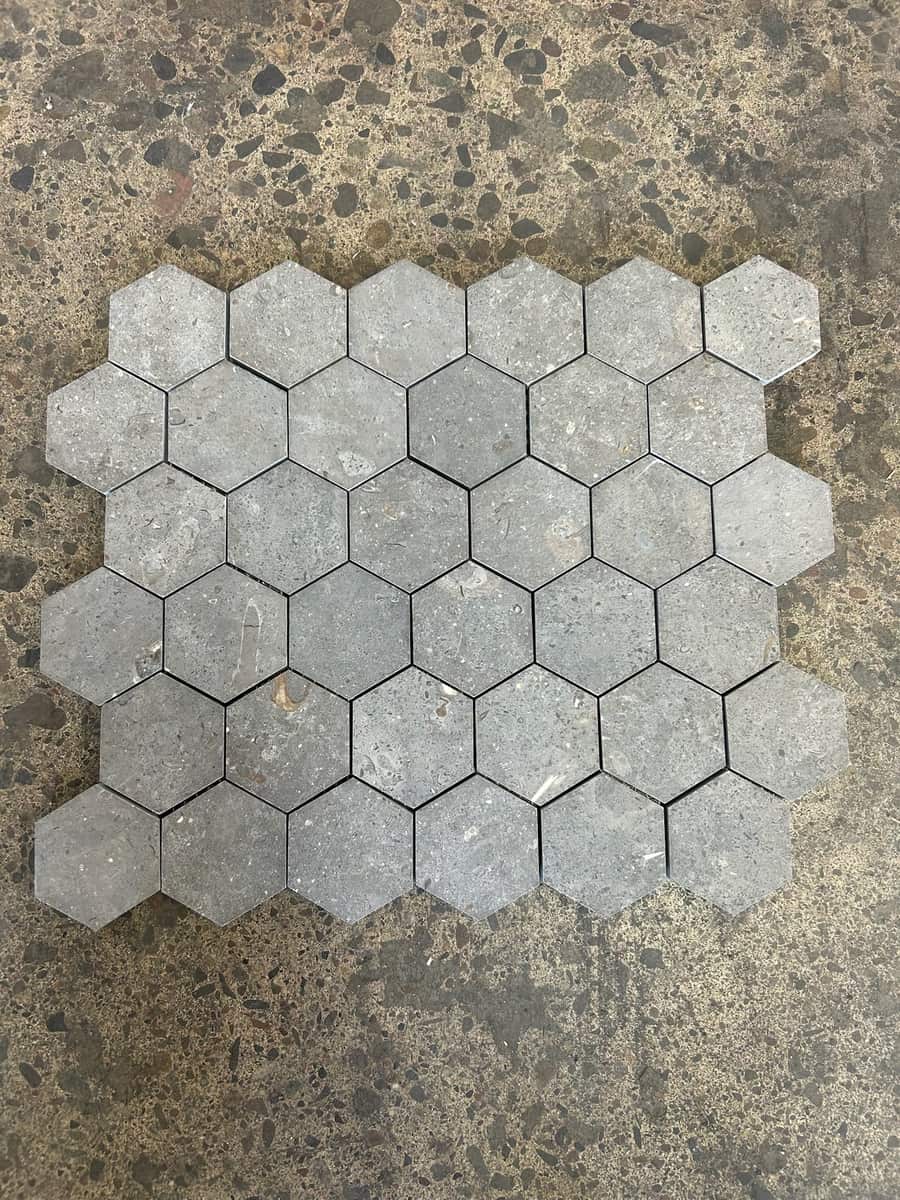 Grey hexagon mosaic on a concrete floor
