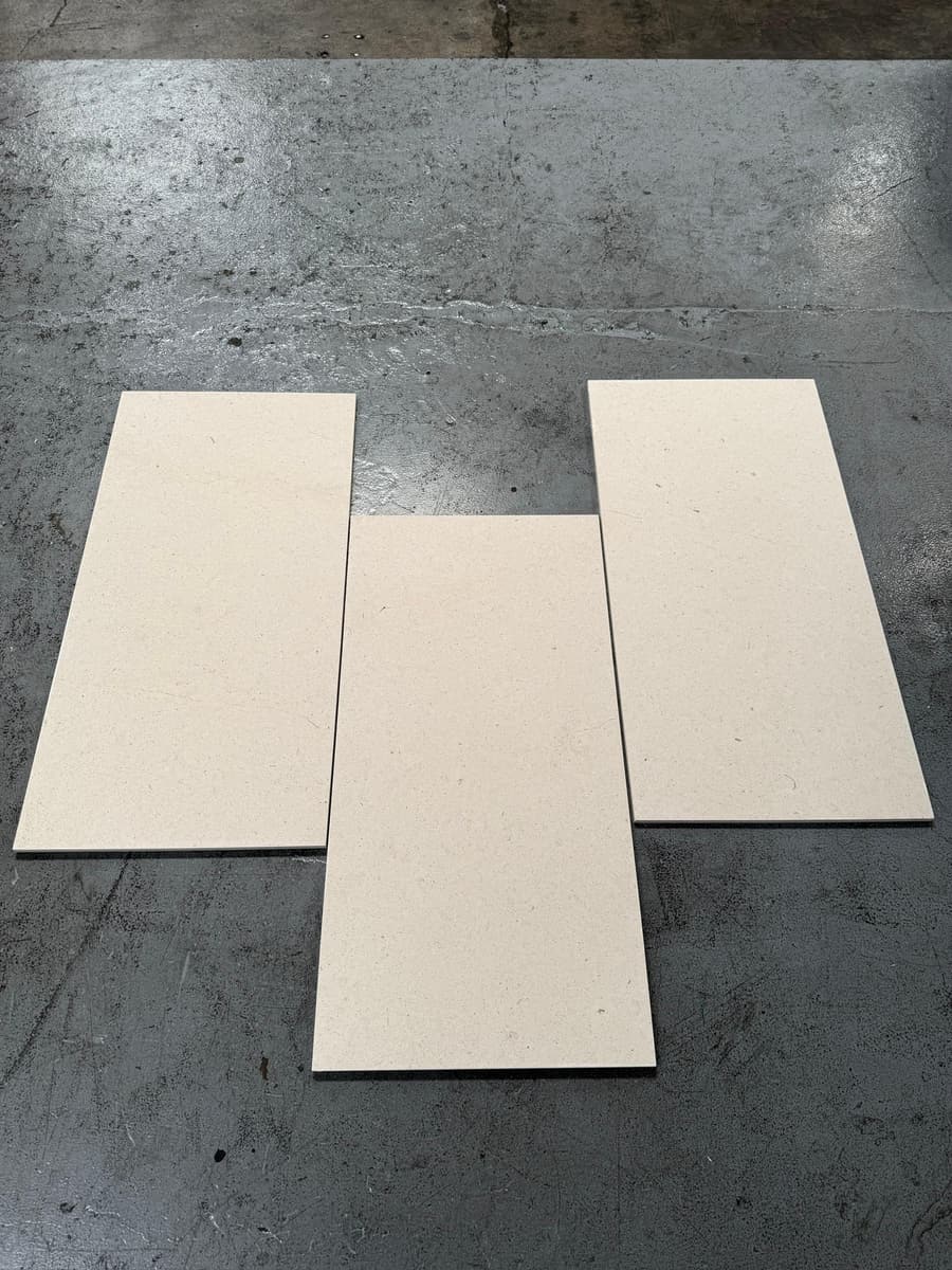 Cream plank tile laid out on concrete