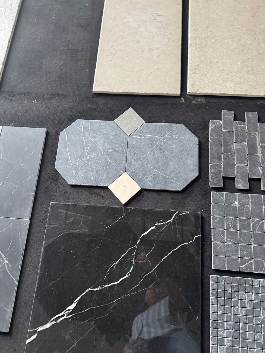 Dark marble and octagon tile samples laid out