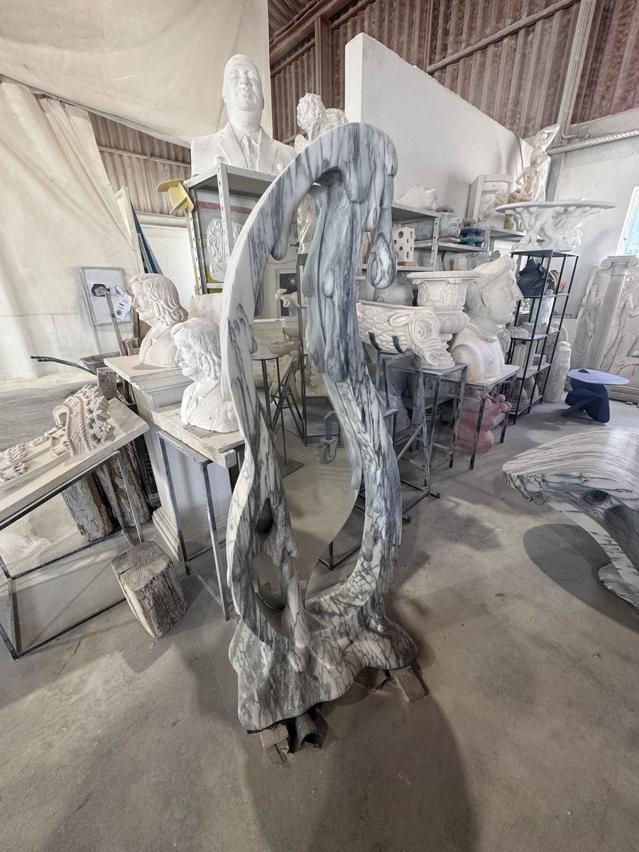 Carved basin and sculpted pieces in the workshop